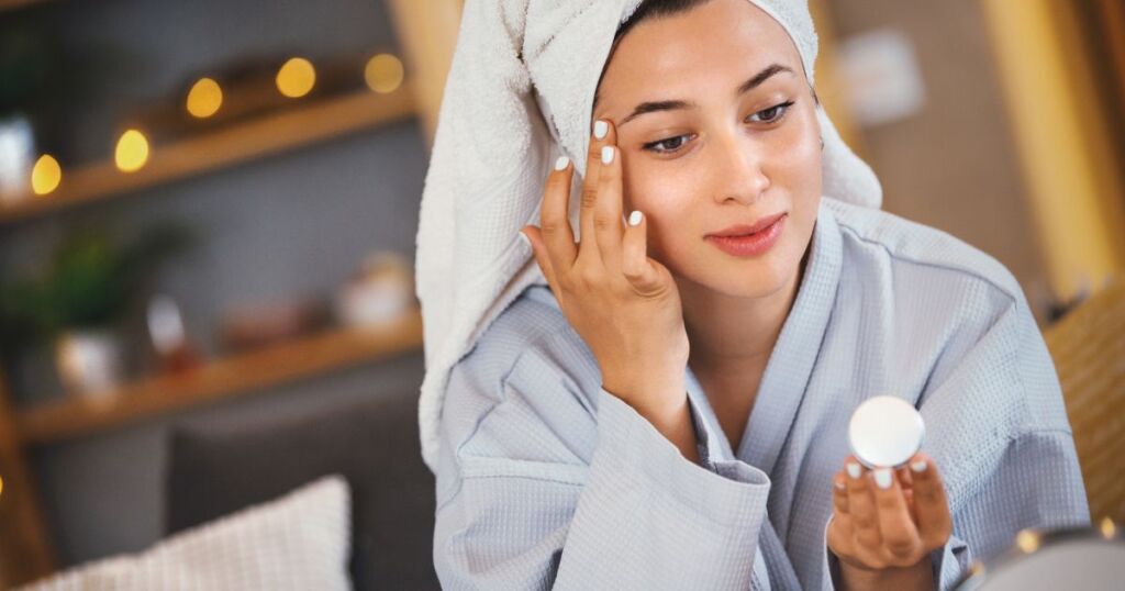 woman applying face cream